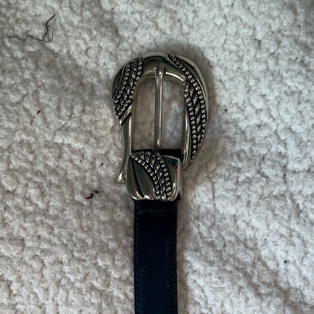 Classic Black Leather Belt with Intricate Silver Buckle